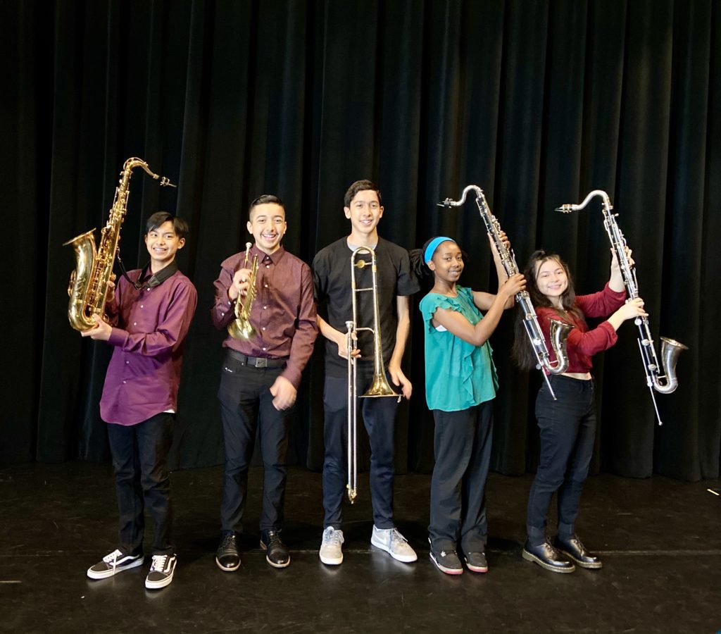 kids standing with instruments
