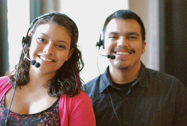 man and women wearing headsets