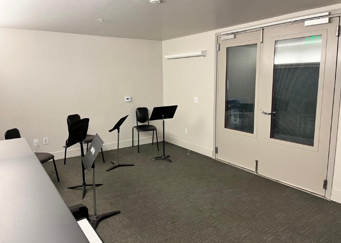 music room with chairs and stands